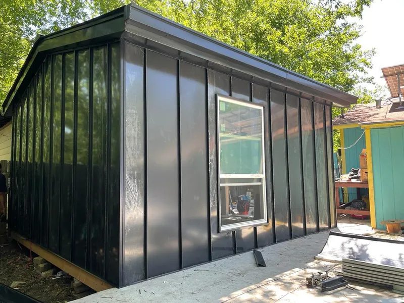 Black standing seam metal wall panels for Metal Roof Installation in Gladstone